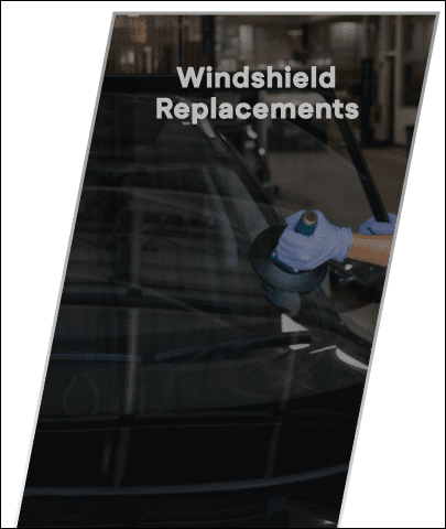Technician replacing car windshield